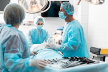 a surgeon focusing on his patient