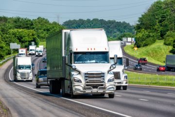 Trucks and personal vehicles navigate a busy interstate 81.