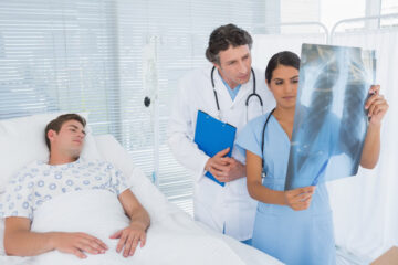 Patient from car accident looking at his xray result.