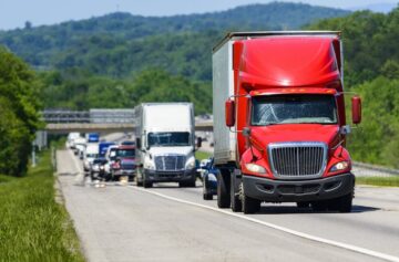 Red truck passing the interstate highway